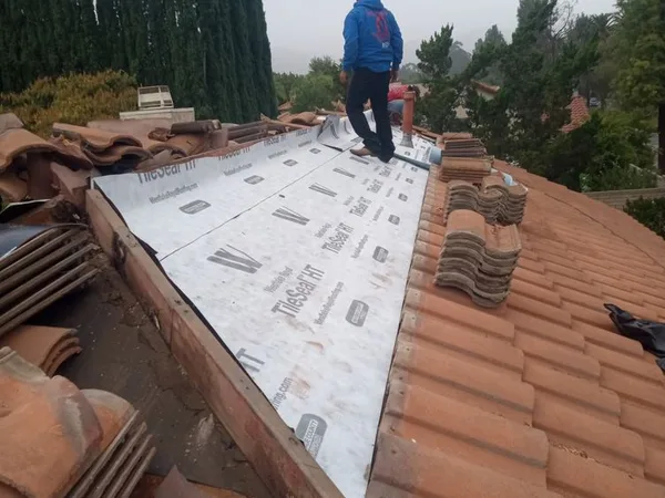 Tile roof installation in progress